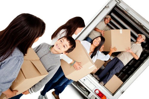 Removals team planning a move on a busy Camdentown street
