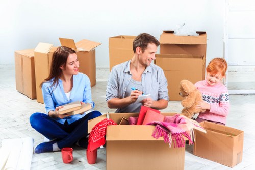 Moving crew handling desks and files during an office relocation