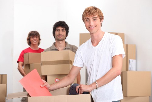 Packed boxes and furniture loaded into a removal van